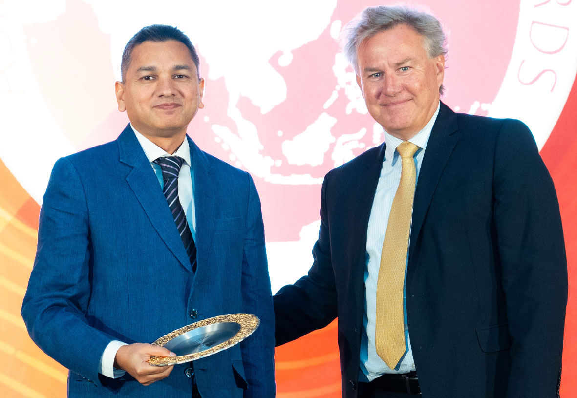 Go Digit General Insurance head of data science Ashish Khandelwal (L) accepting the award from NMG Consulting Global Partner Stephen Collins